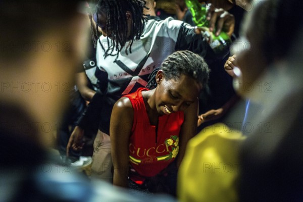 RWA RWANDA RUANDA Kigali Guests at a regular party organised by the Inema Gallery. Artists, locals and expats meet here every Thursday