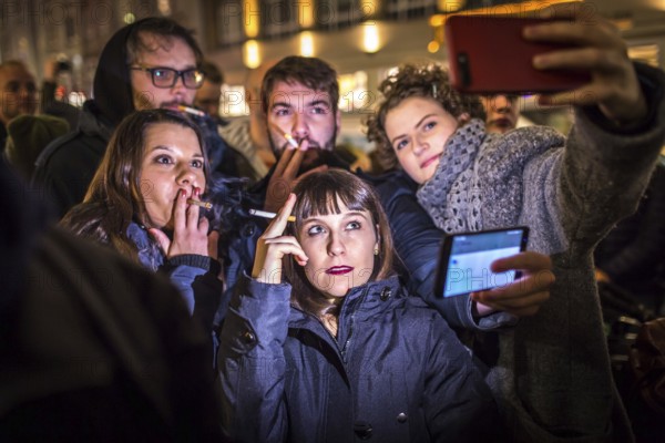 DEU Germany Germany Berlin Smoking for Deniz in front of the Taz