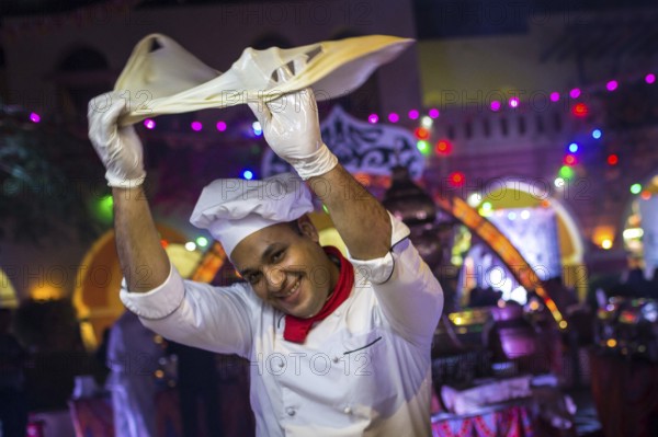 Egypt Hurghada A baker turns his bread dough in the air during an evening promotional event for Egyptian tourism