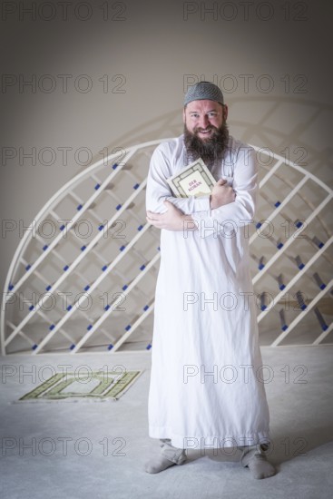 DEU Germany Germany Berlin The head of the Ibn Rushd Goethe Mosque, Christian Hermann, poses in the prayer room. The mosque is located on the premises of the Protestant St John's Church in Moabit