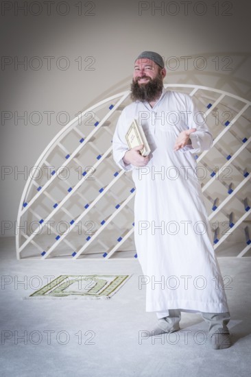 DEU Germany Germany Berlin The head of the Ibn Rushd Goethe Mosque, Christian Hermann, poses in the prayer room. The mosque is located on the premises of the Protestant St John's Church in Moabit