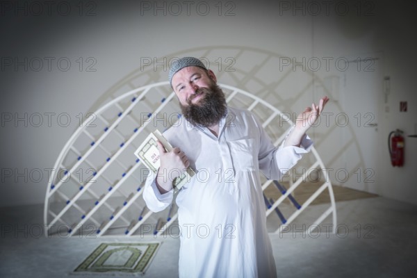 DEU Germany Germany Berlin The head of the Ibn Rushd Goethe Mosque, Christian Hermann, poses in the prayer room. The mosque is located on the premises of the Protestant St John's Church in Moabit