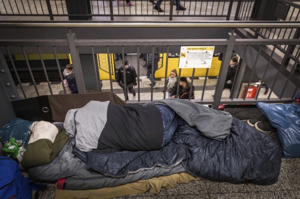 DEU Germany Germany Berlin Homeless people spend the night in a passageway at Lichtenberg underground station. Like Moritzplatz, the station has been made available by the BVG for overnight stays during the winter months