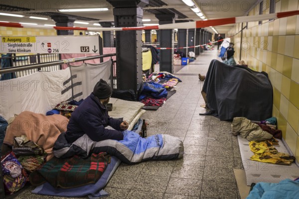 DEU Germany Germany Berlin Homeless people spend the night in a passageway at Lichtenberg underground station. Like Moritzplatz, the station has been set aside by the BVG for overnight stays during the winter months