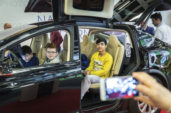DEU Germany Germany Berlin Scene of the Green Weeks, the annual trade fair for food, agriculture and ecology. Test drive in the Tesla X