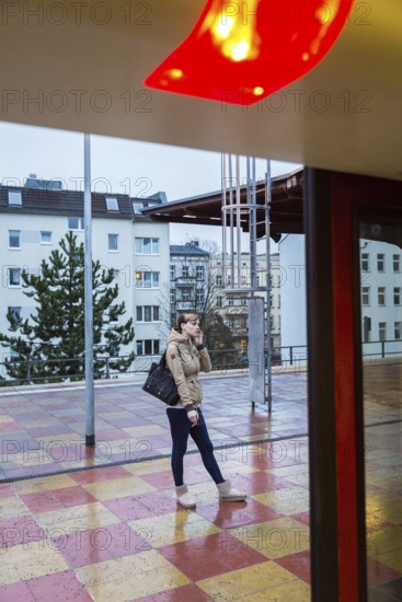 DEU Germany Germany Berlin Scenes in and around the S-Bahn.waiting woman in Pankow