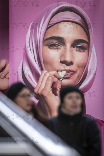 DEU Germany Germany Berlin An advertising banner with a Muslim woman promoting Katjes vegetarian products at Berlin Central Station