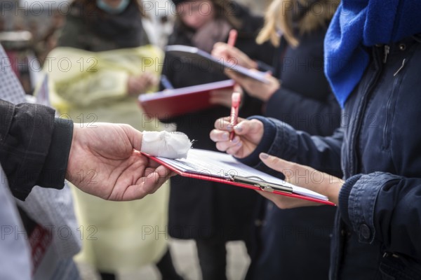 DEU Germany Germany Berlin Members of the 'Referendum for Healthy Hospitals' initiative collect signatures at Warschauer Brücke in Friedrichshain to realise a referendum