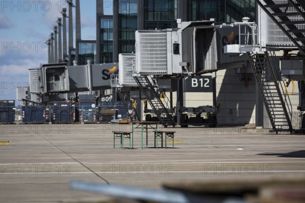 DEU Germany Germany Berlin Views of BER Berlin Brandenburg Airport, which is scheduled to open in 2020. Beer benches and beer table on the apron