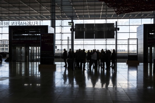 DEU Germany Germany Berlin Views of BER Berlin Brandenburg Airport, scheduled to open in 2020. Group of visitors in the main terminal