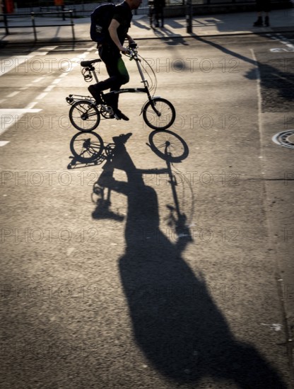 DEU Germany Germany Berlin Cyclist at the intersection at Frankfurter Tor in Friedrichshain