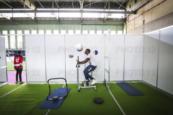 DEU Germany Germany Berlin As part of the German Foundation Week, the Cologne-based organisation Rheinflanke demonstrates sports facilities for refugees in the hangar at Tempelhof Airport. African refugees do exercises in a weight room in Hangar 1