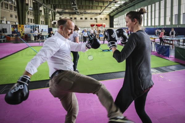 DEU Germany Germany Berlin As part of the German Foundation Week, the Cologne-based organisation Rheinflanke demonstrates sporting opportunities for refugees in the hangar at Tempelhof Airport. Exercises for kick-boxing