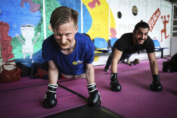 DEU Germany Germany Berlin As part of the German Foundation Week, the Cologne-based organisation Rheinflanke demonstrates sporting opportunities for refugees in the hangar at Tempelhof Airport. Exercises for kick-boxing