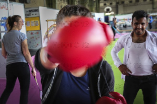 DEU Germany Germany Berlin As part of the German Foundation Week, the Cologne-based organisation Rheinflanke demonstrates sporting opportunities for refugees in the hangar at Tempelhof Airport. Exercises for kick-boxing