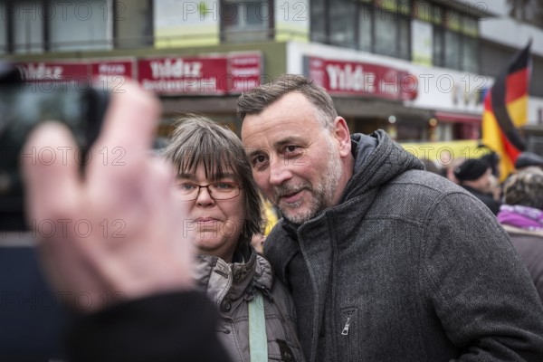 DEU Germany Germany Berlin Demonstration ' March of Women, which was organised by AFD member, Kurdish woman Leyla Bilge. The protest was directed against the sexism of asylum seekers and the German government's immigration policy. Lutz Bachmann poses with a fan