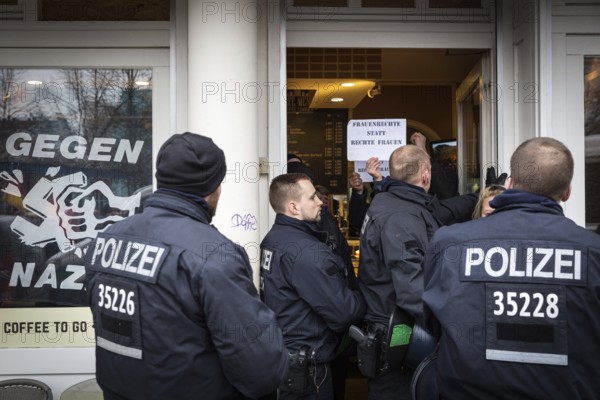 DEU Germany Germany Berlin Demonstration ' March of Women, which had been organised by AFD member, the Kurdish woman Leyla Bilge. The protest was directed against the sexism of asylum seekers and the German government's immigration policy. counter-demonstrators in a snack bar at Hallesches Tor