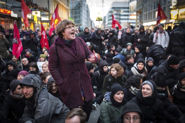 DEU Germany Germany Berlin Demonstration ' March of Women, which was organised by AFD member, the Kurdish woman Leyla Bilge. The protest was directed against the sexism of asylum seekers and the German government's immigration policy. Counter-demonstrators form a sit-in blockade at Checkpoint Charlie