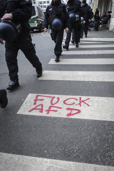 DEU Germany Germany Berlin Demonstration ' March of Women, which was organised by AFD member, the Kurdish woman Leyla Bilge. The protest was directed against the sexism of asylum seekers and the German government's immigration policy.graffiti by counter-demonstrators on a zebra crossing at Hallesches Tor