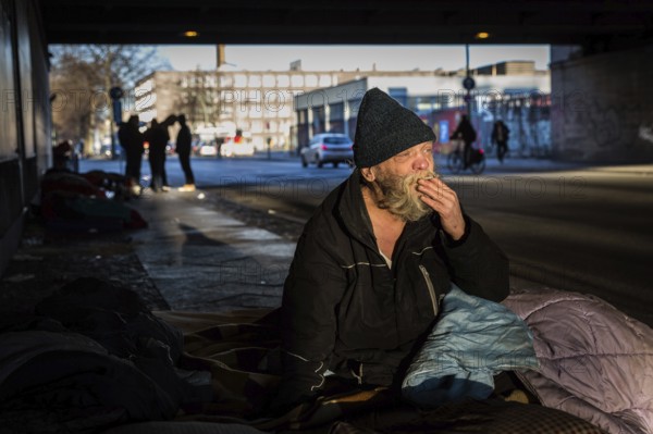 DEU Germany Germany Berlin Scenes of homeless people around Bahnhof Zoo.Gerard on his bed under a bridge in the morning