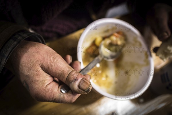 DEU Germany Germany Berlin Scenes of homeless people in the Protestant City Mission in Lehrter Straße near the main railway station Homeless people having dinner