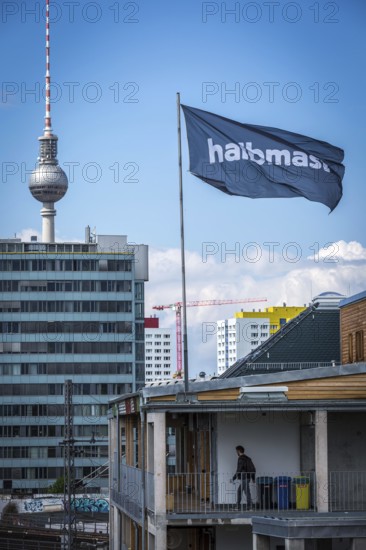 DEU Germany Germany Berlin The alternative project Holzmarkt on the banks of the Spree The flag 'half-mast' flies over the Holzmarkt