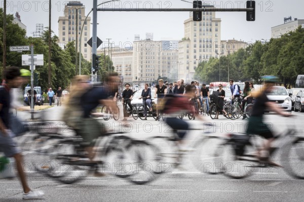 DEU Germany Germany Berlin Scene with cyclists in traffic in the capital Karl-Marx-Alle, corner of Otto-Braun-Str