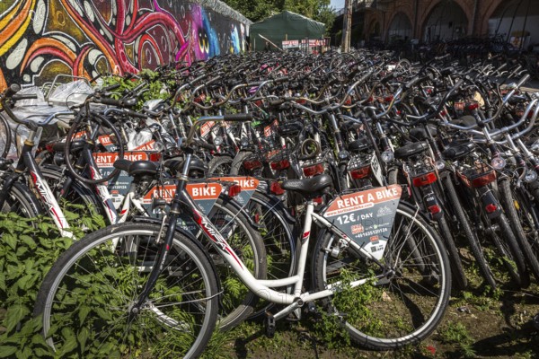 DEU Germany Germany Berlin Rental bikes in the city.bikes from the provider berlinandbike.com are parked on a site at the S-Bahn arches behind Zoo station