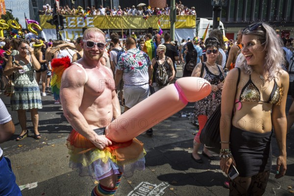 DEU Germany Germany Berlin Scenes of the Christopher Street Day CSD on a hot Saturday . Man with giant plastic cock
