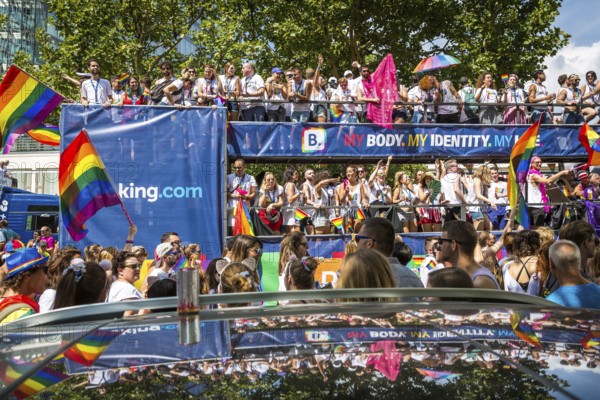 DEU Germany Germany Berlin Scenes of the Christopher Street Day CSD on a hot Saturday . The car from booking.com