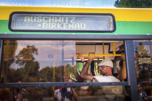 POL Poland Poland Auschwitz-Birkenau Tourists on the bus on the way to the Auschwitz-Birkenau camp