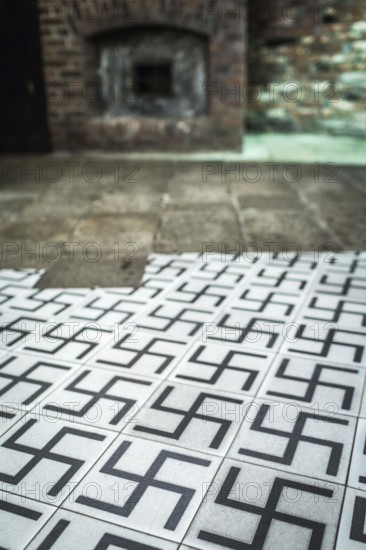 POL Poland Poland Krakow Krakow Tiles with swastikas in the exhibition of the Oskar Schindler factory