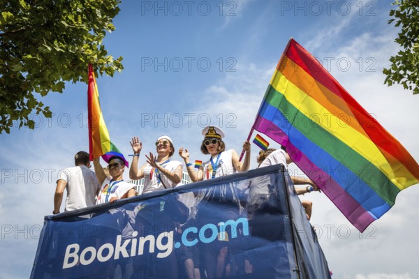 DEU Germany Germany Berlin Scenes of the Christopher Street Day CSD on a hot Saturday . The car from booking.com