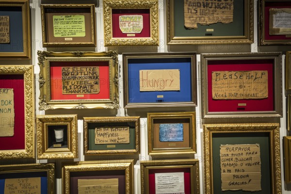 DEN Denmark Aarhus The Danish art museum Aros. Framed signs of homeless people