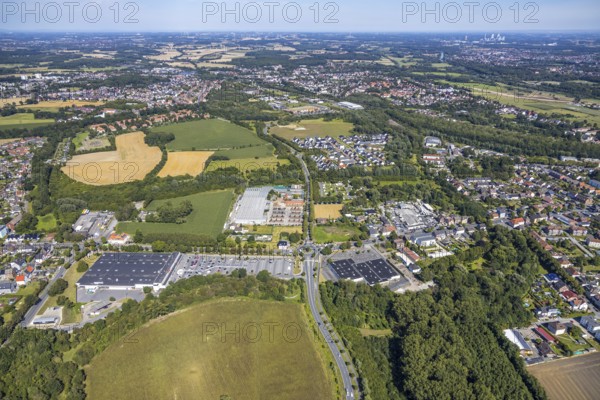 Aerial view, business location Münsterstraße, roundabout Warendorfer Straße - Münsterstraße, Real department stores', Hamm, Ruhr area, North Rhine-Westphalia, Germany, DE, Europe, birds-eyes, view, aerial photography, aerial photography, overview, overview, bird's eye view, shopping, food, clothing, consumption, consumer, road traffic, connection, road layout, intersection, junction, traffic management, driving licence, transport, traffic, infrastructure, logistics