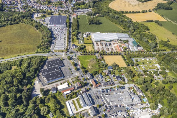 Aerial view, business location Münsterstraße, roundabout Warendorfer Straße - Münsterstraße, Real department stores', Hamm, Ruhr area, North Rhine-Westphalia, Germany, DE, Europe, birds-eyes, view, aerial photography, aerial photography, overview, overview, bird's eye view, shopping, food, clothing, consumption, consumer, road traffic, connection, road layout, intersection, junction, traffic management, driving licence, transport, traffic, infrastructure, logistics