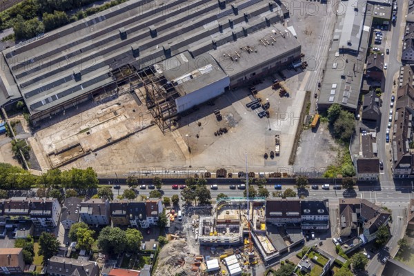 Aerial view, construction site on the WDI site between Bahndamm and Otto-Brenner-Straße, new district centre Wilhelmstraße, Hamm, Ruhr area, North Rhine-Westphalia, Germany, DE, Europe, birds-eyes, view, aerial photograph, aerial photography, aerial photography, overview, overview, bird's eye view, railway line, railway network, infrastructure, transport, train traffic, freight traffic, railway network, metal processing, metal processing, industry, production, workplaces