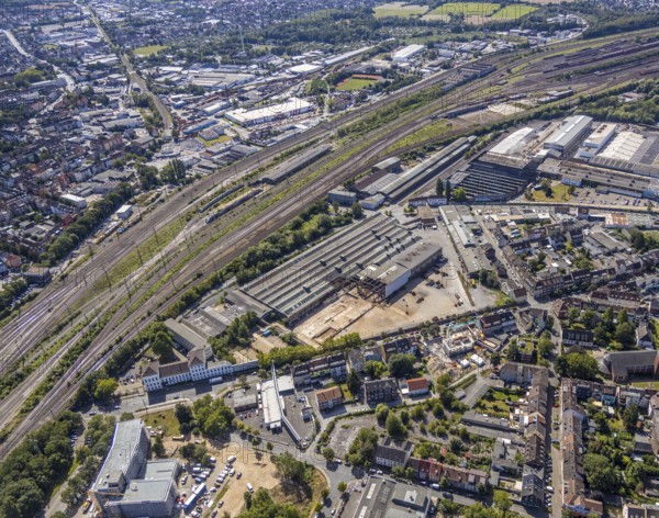 Aerial view, construction site on the WDI site between Bahndamm and Otto-Brenner-Straße, new district centre Wilhelmstraße, Hamm, Ruhr area, North Rhine-Westphalia, Germany, DE, Europe, birds-eyes, view, aerial photograph, aerial photography, aerial photography, overview, overview, bird's eye view, railway line, railway network, infrastructure, transport, train traffic, freight traffic, railway network, metal processing, metal processing, industry, production, workplaces