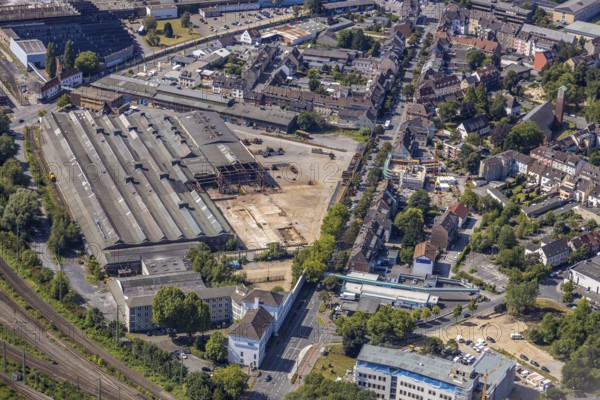 Aerial view, construction site on the WDI site between Bahndamm and Otto-Brenner-Straße, new district centre Wilhelmstraße, Hamm, Ruhr area, North Rhine-Westphalia, Germany, DE, Europe, birds-eyes, view, aerial photograph, aerial photography, aerial photography, overview, overview, bird's eye view, railway line, railway network, infrastructure, transport, train traffic, freight traffic, railway network, metal processing, metal processing, industry, production, workplaces