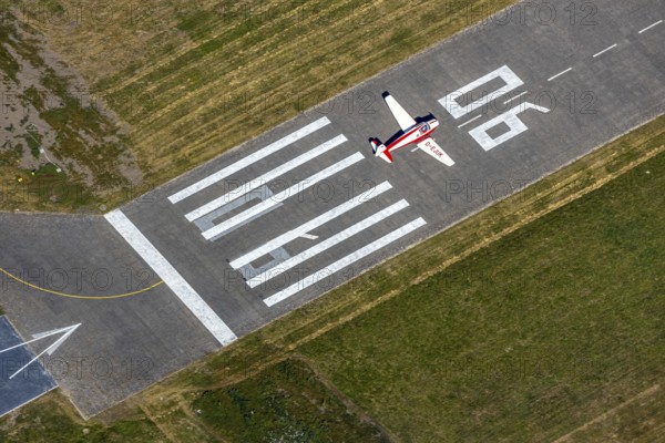 Aerial photo, Hamm airfield, aircraft Klemm 107 B, D-EJUK, Hamm, Ruhr area, North Rhine-Westphalia, Germany, DE, Europe, flight emission, airport, aircraft noise, airfield, airfield area, aircraft, aircraft D-EJUK, runway, aerial photo, aerial photography, aerial photography, runway, overview, bird's-eye view, overview