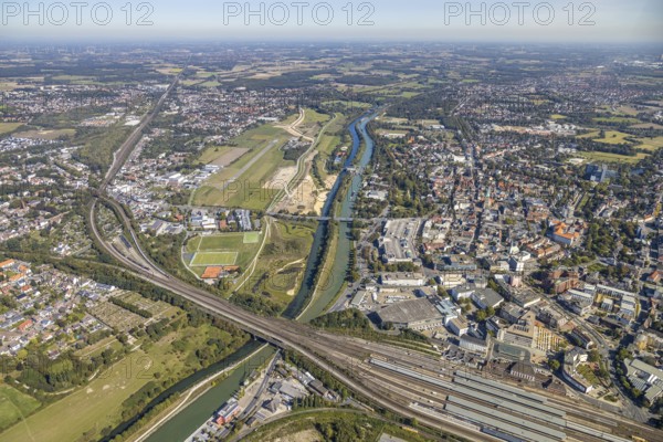Aerial view, Hamm airfield, Mattenbecke sewage treatment plant, Lippe floodplain, Hamm lock, Lippe river, Datteln-Hamm canal, construction site, Hamm, Ruhr area, North Rhine-Westphalia, Germany, wastewater treatment plant, wastewater treatment, railway tracks, DE, Europe, flight emission, airport, aircraft noise, airfield, airfield site, sewage treatment plant, runway, aerial view, aerial photography, aerial photography, Münsterstrasse, runway, overview, bird's-eye view, water treatment plant, water purification plant, birds-eyes view, overview