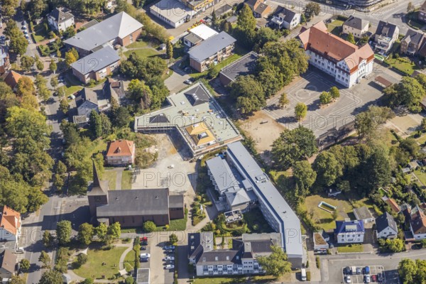 Aerial view, Catholic Church of the Holy Cross, Lessing School, Caritas Association Hamm, Caritas Home for the Elderly St. Josef, construction site, new building, Haus der Begegnung, Herringen, Hamm, Ruhr area, North Rhine-Westphalia, Germany, retirement home, retirement home, place of worship, construction work, construction, construction area, building site, building plots, construction project, construction site, care and nursing, education, educational institution, Buschkampstraße, DE, Europe, religious community, house of worship, primary school, Holzstraße, church, parish, denomination, educational institute, aerial view, aerial photography, aerial photography, new building, care facility, religion, school, retirement home, retirement home, retirement home, retirement centre, overview, bird's-eye view, bird's-eye view, overview