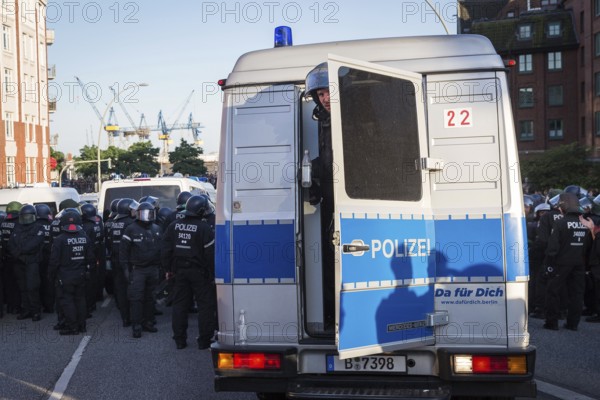 DEU Germany Germany Hamburg Protests in front of and during the 'Welcome to hell' demonstration in the run-up to the G20 summit. Berlin police officer looks out of his squad car