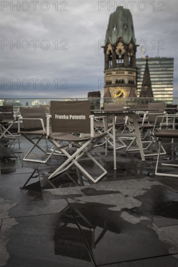 DEU Germany Germany Berlin A chair bearing the name of German actress Franka Potente stands on the rain-soaked terrace of the newly opened Motel One Upper West on Breitscheidtplatz