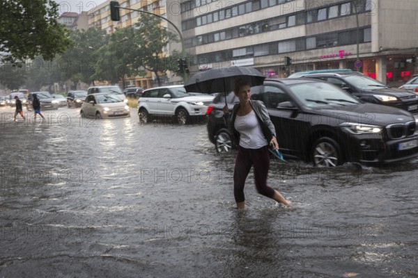 DEU Germany Germany Berlin Scene of the storm in Berlin. People cross the flooded Bundesallee