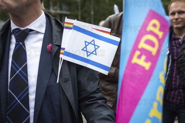 DEU Germany Germany Berlin Pro-Israel demonstration on Kurfürstendamm towards Breitscheidtplatz. Participants with Israel flag, rainbow flag and FDP flag