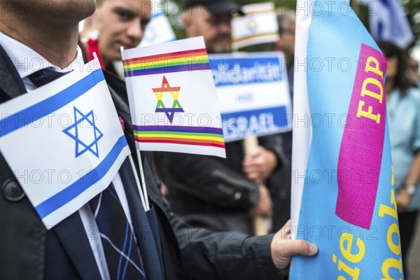 DEU Germany Germany Berlin Pro-Israel demonstration on Kurfürstendamm towards Breitscheidtplatz. Participants with Israel flag, rainbow flag and FDP flag
