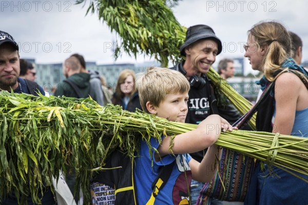 DEU Germany Germany Berlin Scene of the Hemp Parade. Child with hemp plants