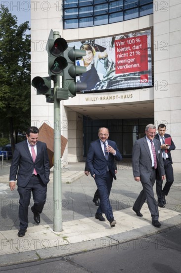 DEU Germany Germany Berlin The SPD chairman and candidate for chancellor Martin Schulz on his way to the inauguration of the memorial to Marie Juchacz, the founder of the Workers' Welfare Association AWO. Hubertus Heil, SPD General Secretary and AWO President Wilhelm Schmidt accompany him