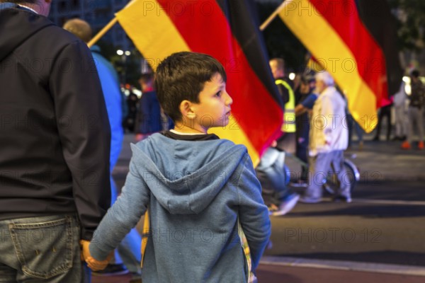 DEU Germany Germany Dresden Pegida demonstration in the city centre. Father and son trying to cross the street